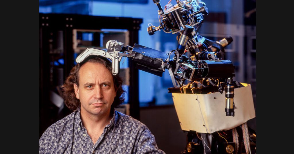 Image of roboticist Rodney Brooks with robot