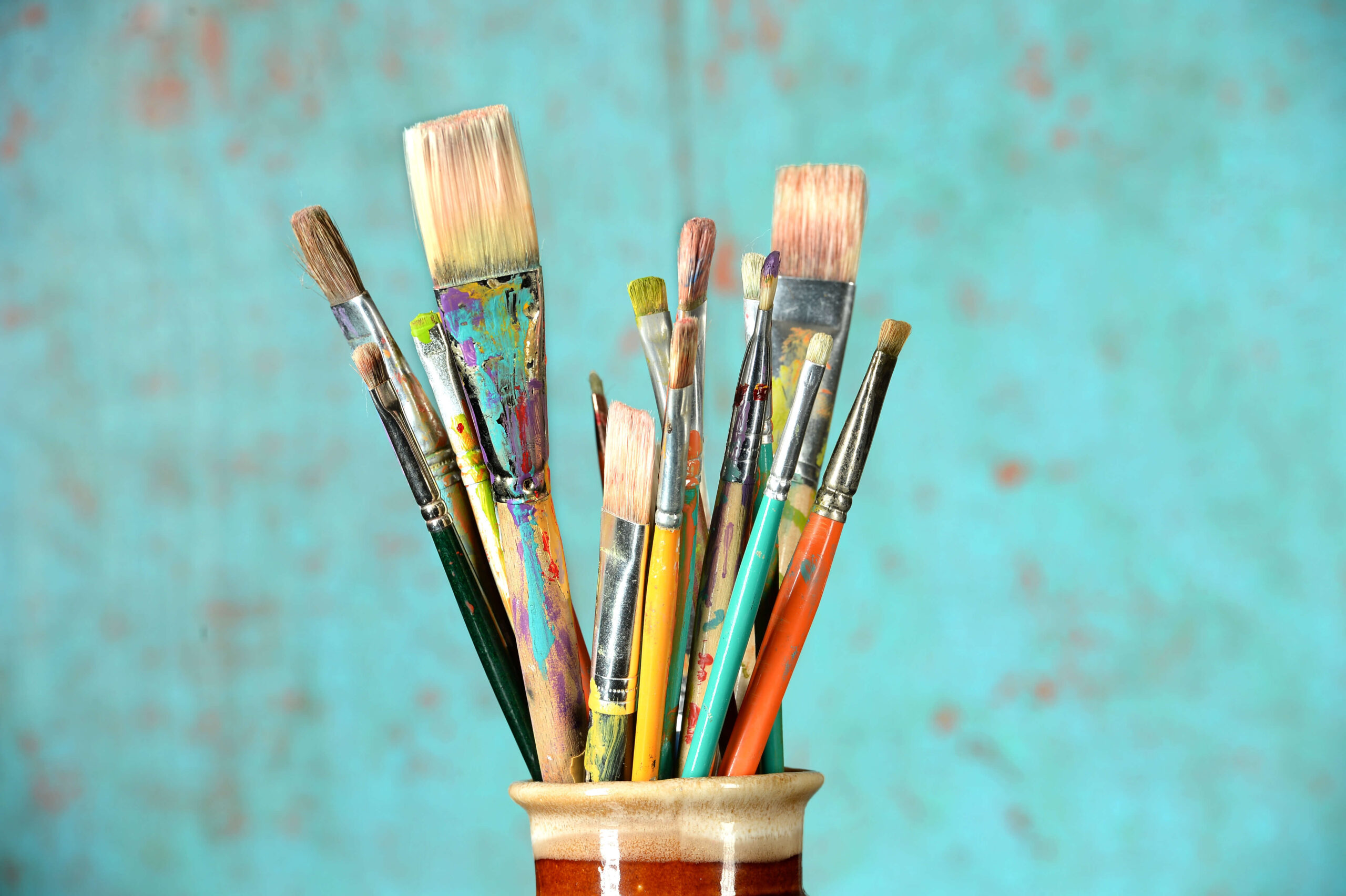 An image of paintbrushes in a jar