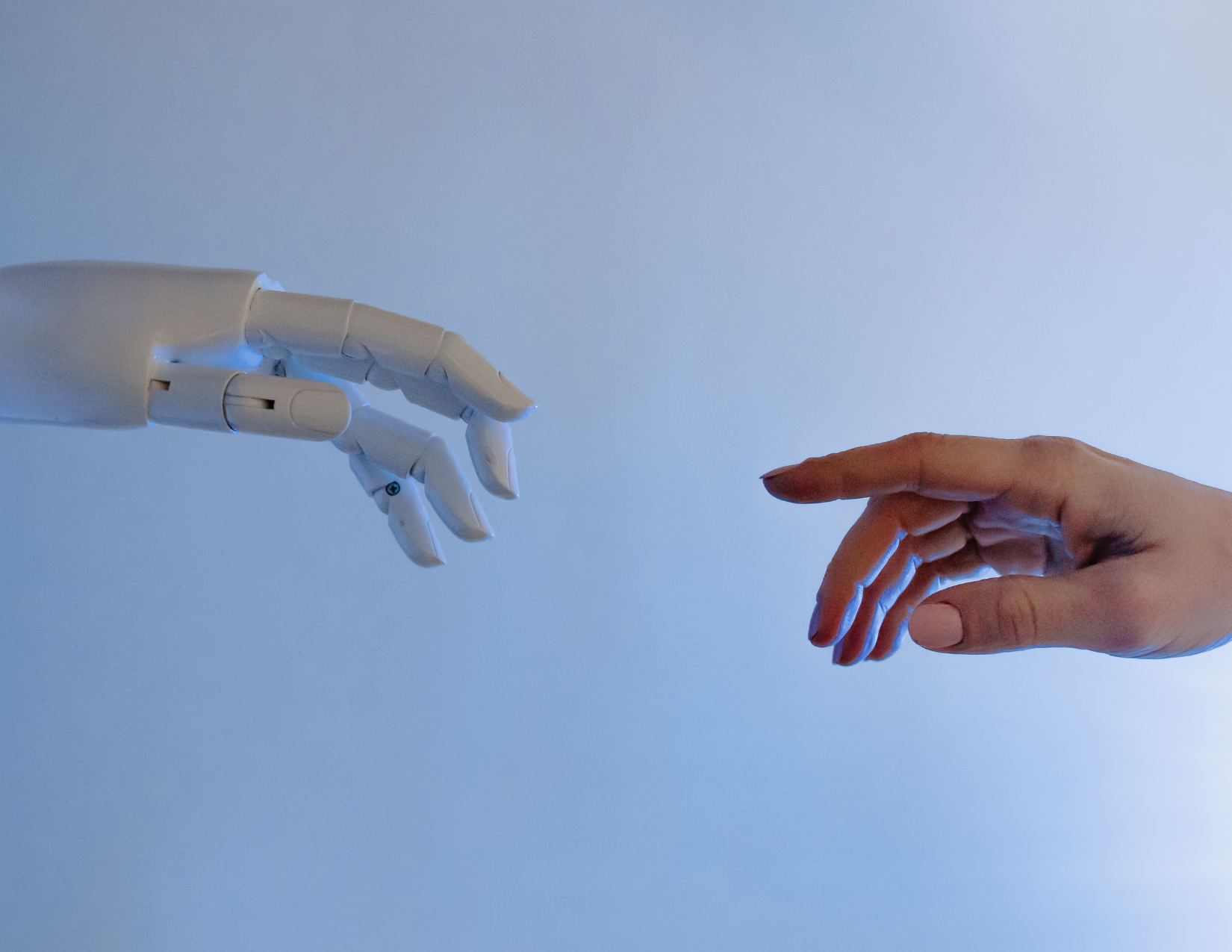 Robot hand reaching out with Human hand